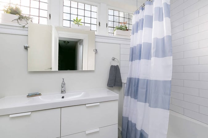 Sink and Striped Shower Curtain