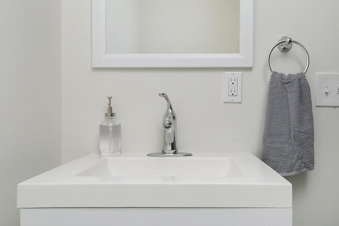 Smaller White Sink with Small Mirror Above