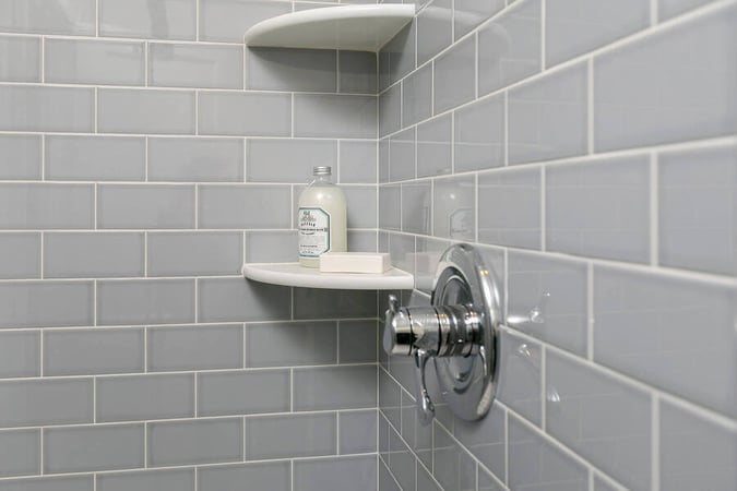 Shelves Inside Shower with Product on Them