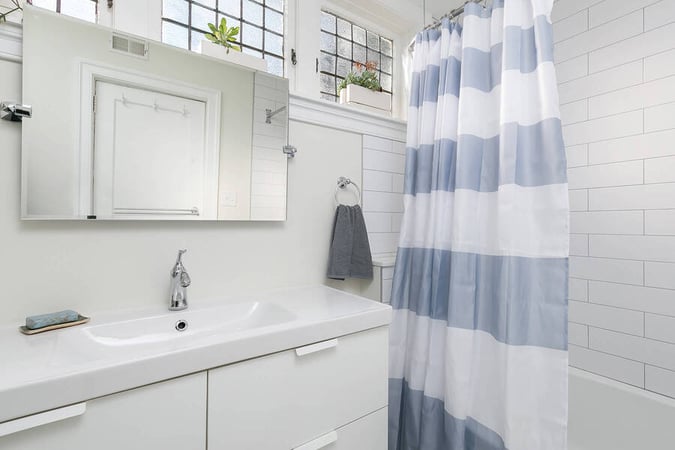 Sink and Striped Shower Curtain