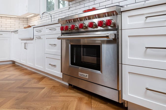 Large stove in kitchen remodel in the Main Line by Bellweather Design-Build